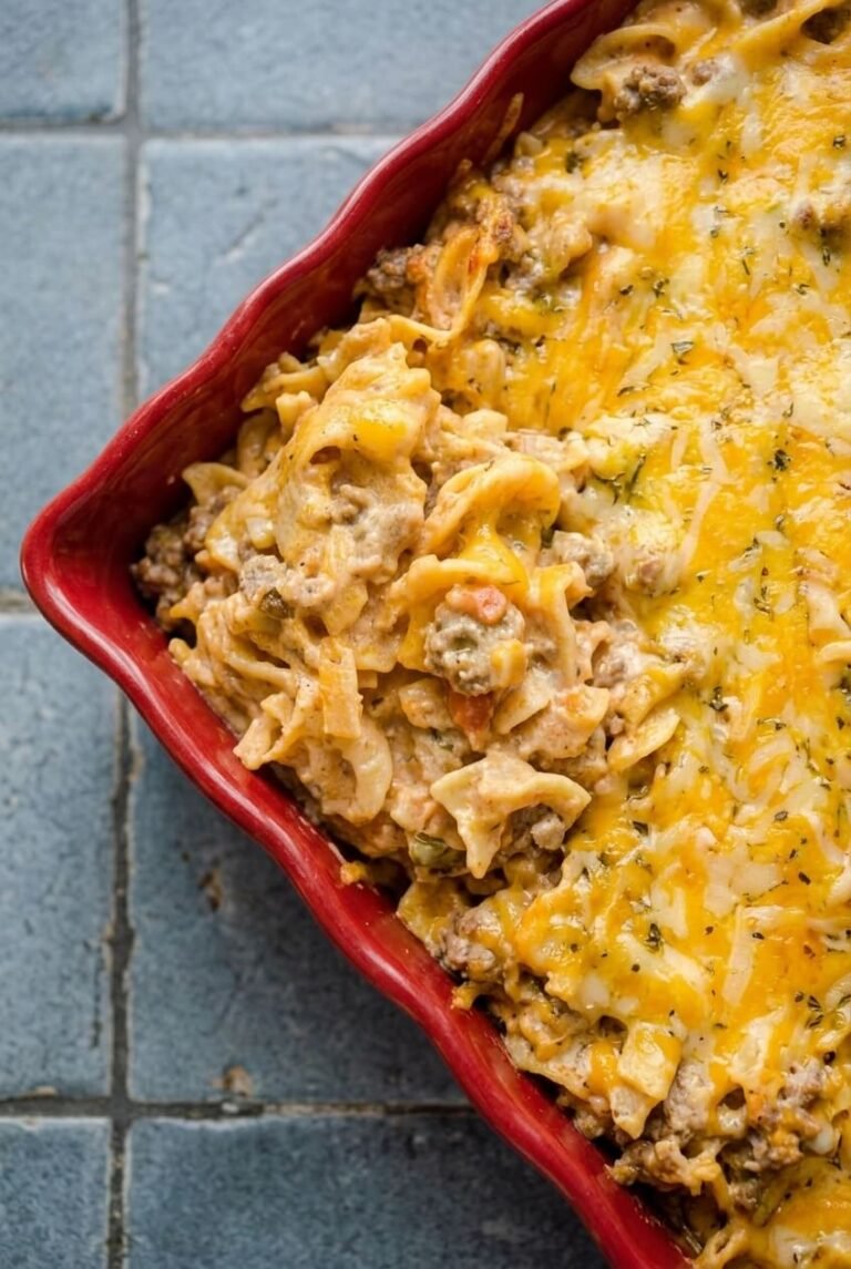 sour cream hamburger hotdish recipe - Sour Cream Hamburger Hotdish served in a white bowl overhead view